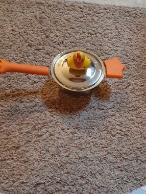 Silicone Handle Stainless Steel Saucepan with Orange Handles and Yellow Lid Knob